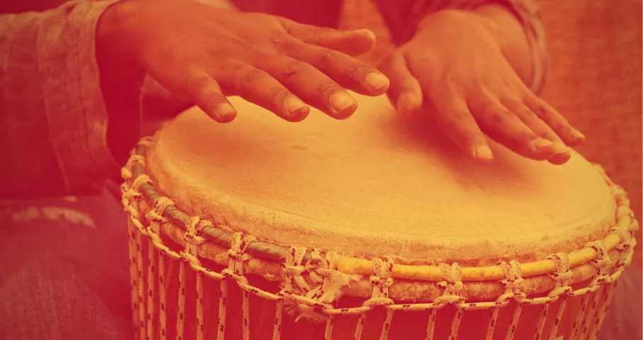 Someone playing a hand drum