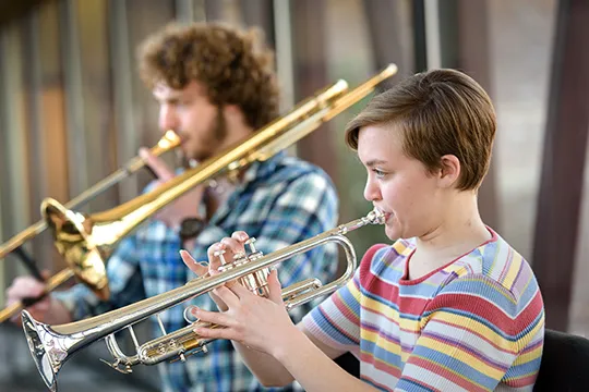 Students playing brass instruments 