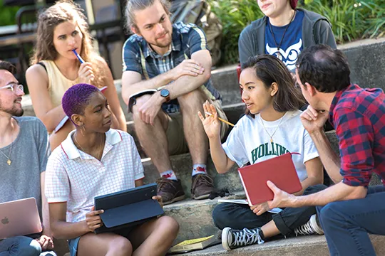 a group of students outside in discussion